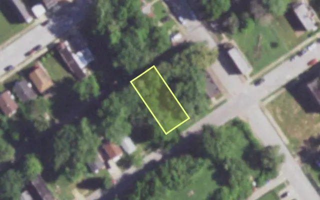 Aerial view of 1409 JOHN AV — vacant lot, St. Louis with approximate parcel outline