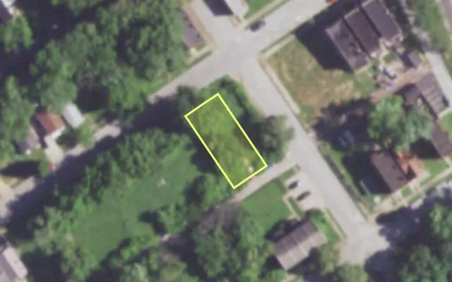 Aerial view of 1402 JOHN AV — vacant lot, St. Louis with approximate parcel outline