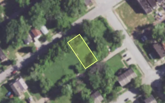 Aerial view of 1410 JOHN AV — vacant lot, St. Louis with approximate parcel outline